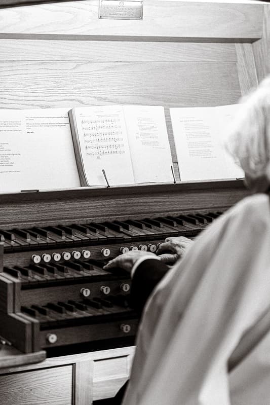 Close detail of the pipe-organ keys, stops and sheet music at St John’s Church, East Dulwich