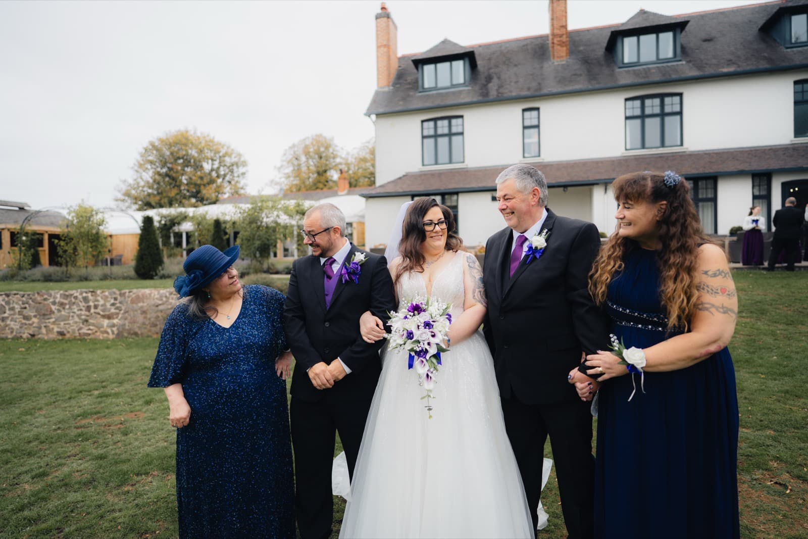 Family group portrait on the lawn at Ashton Lodge Country House
