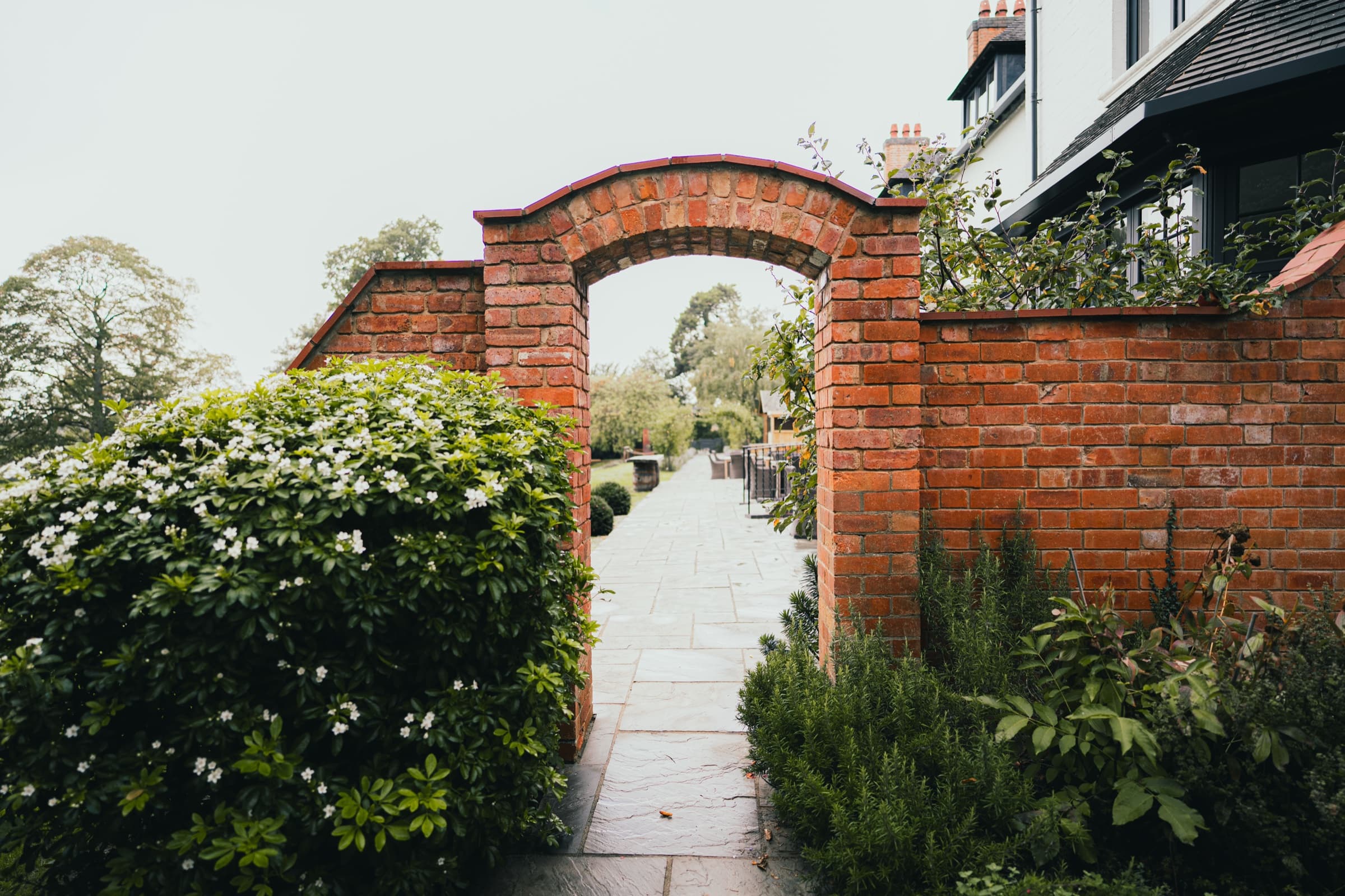 Red brick archway leading into the walled garden grounds of Ashton Lodge Country House