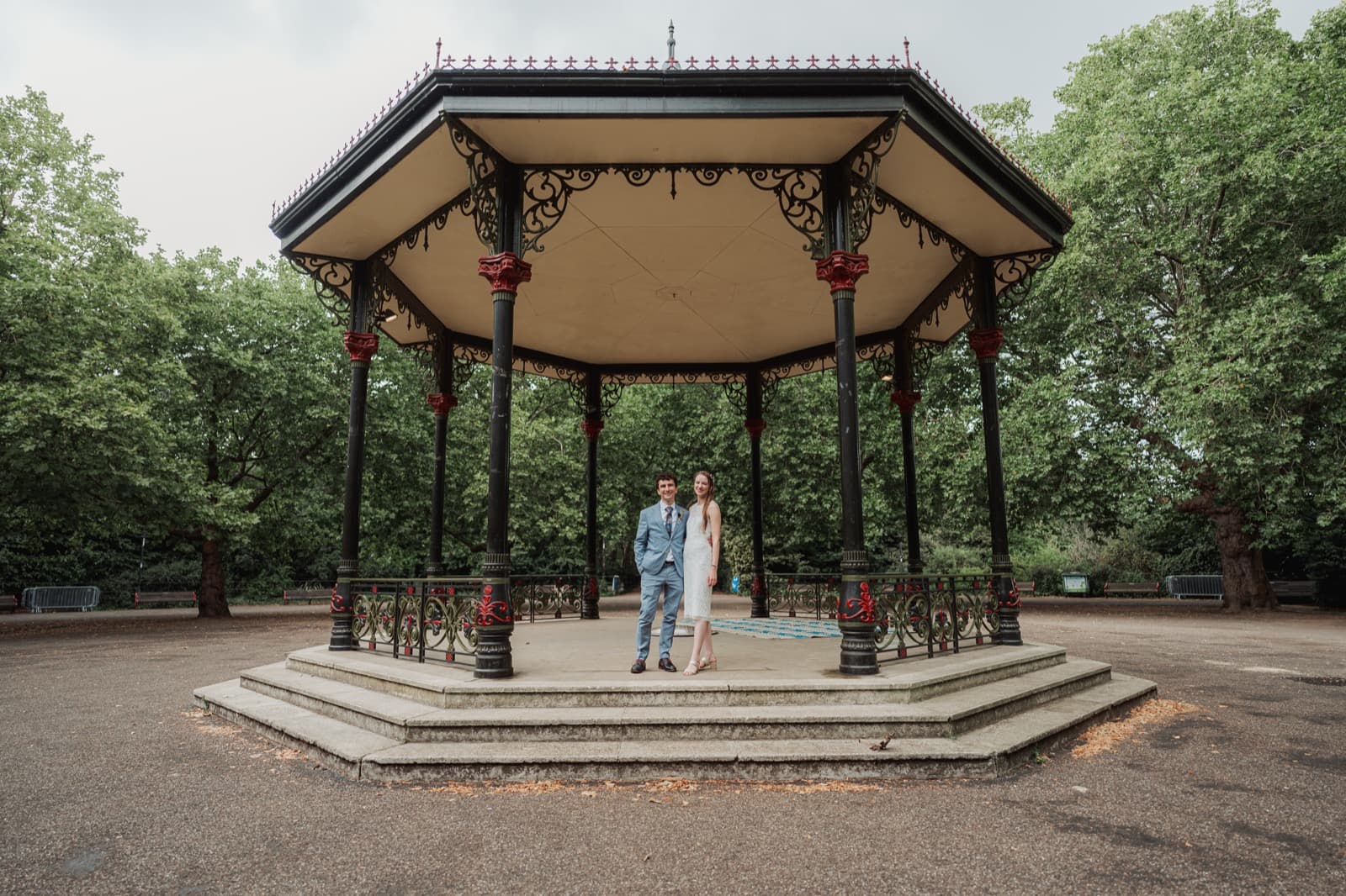 Couple portrait beneath the ornate Battersea Park bandstand