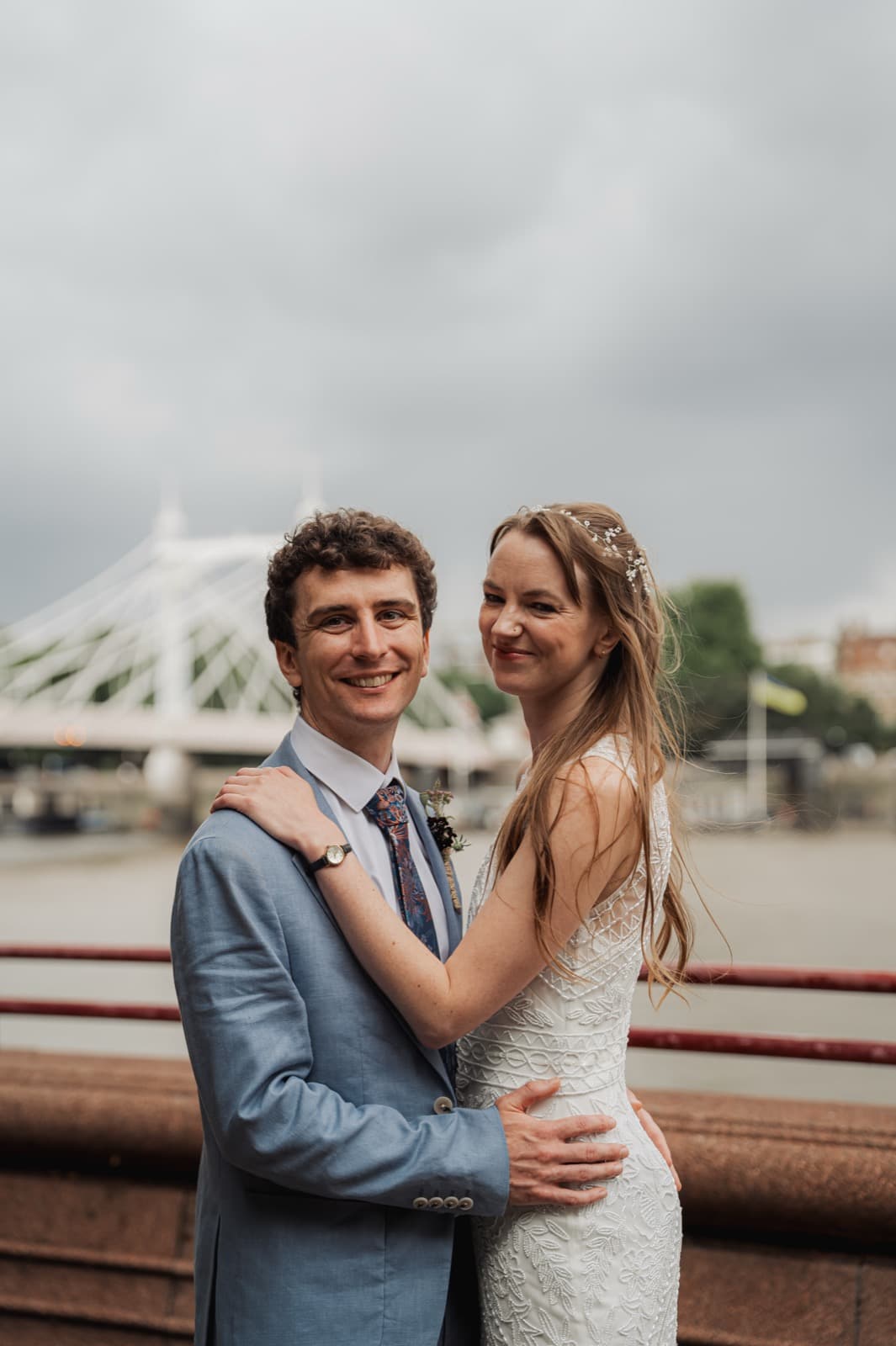 Wedding couple portrait with Albert Bridge behind, Battersea