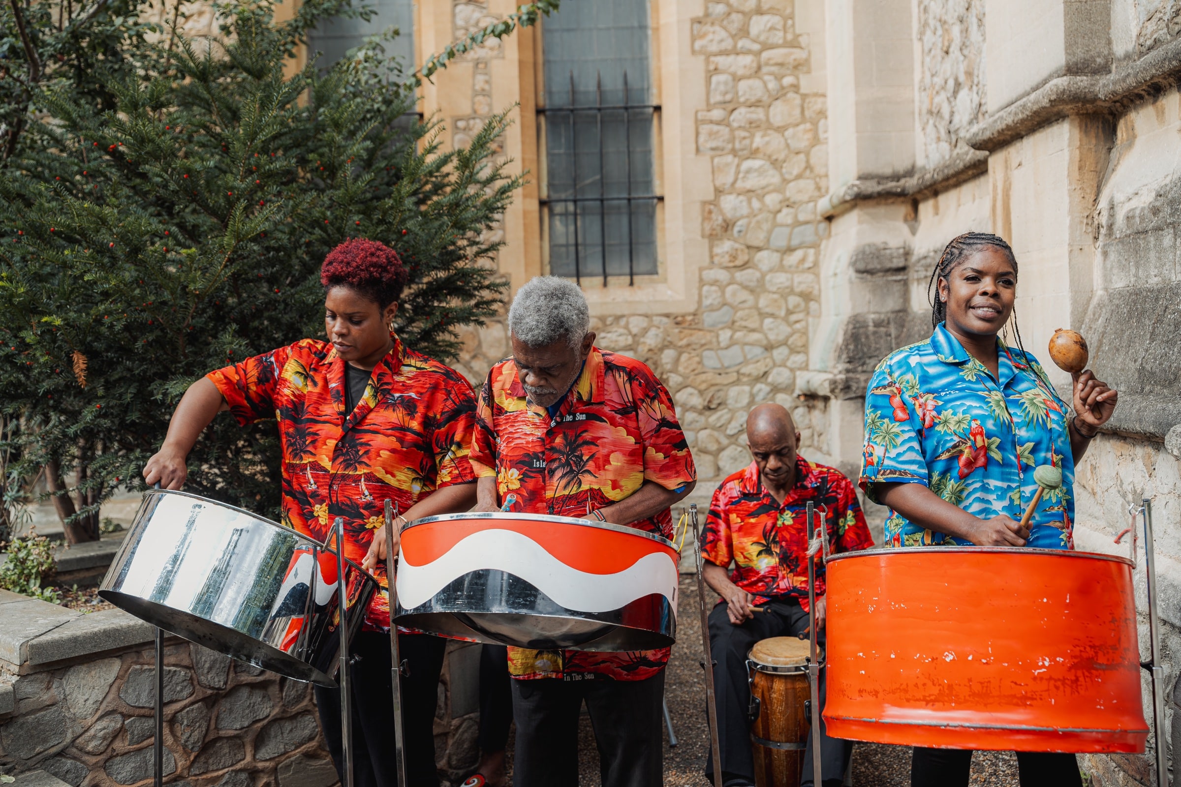A steel band playing at a joyful London wedding celebration, photographed by Evocation Photography