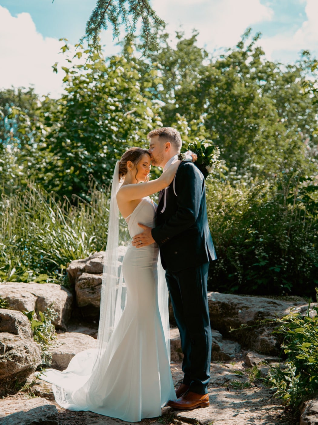 Relaxed, unposed moment between a couple on their wedding day, Evocation Photography