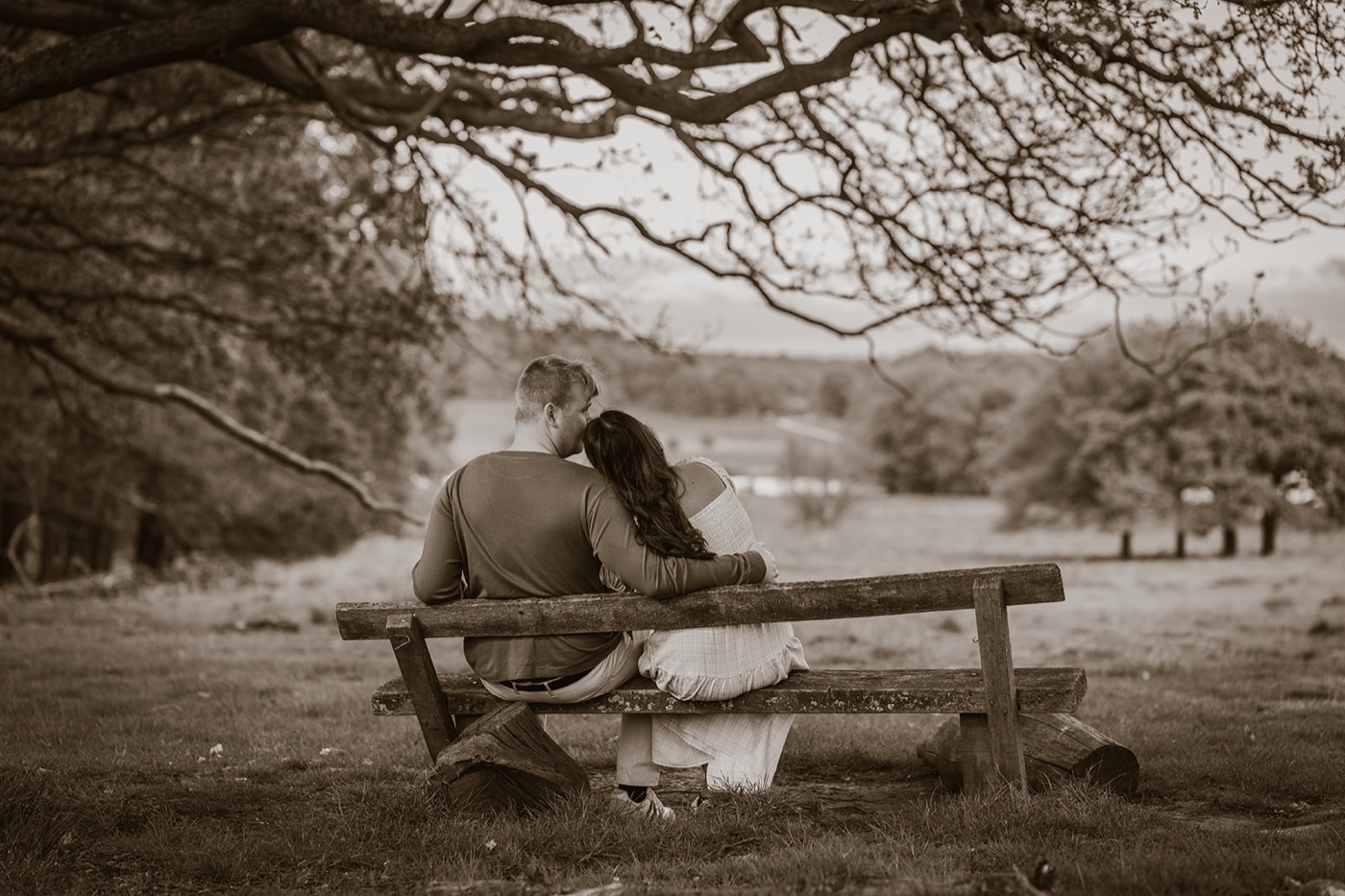 Couple sitting on a bench enjoying the view — portrait photography